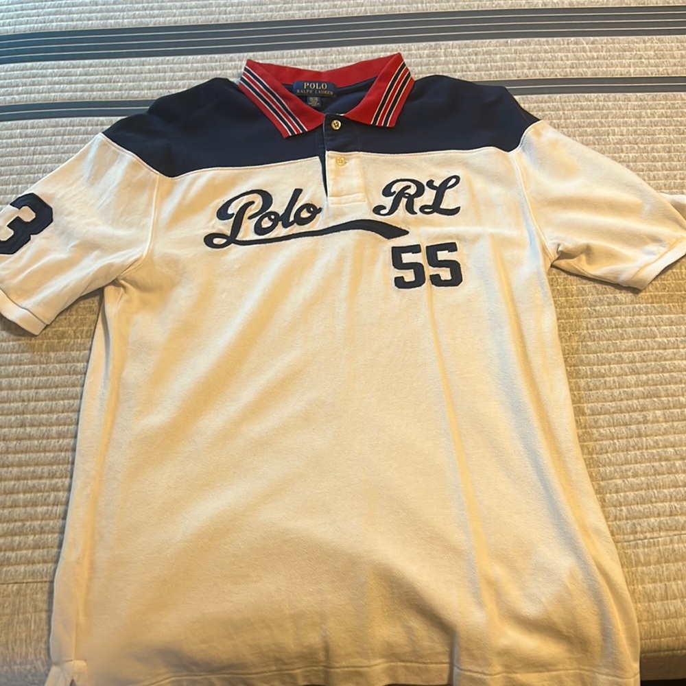 White,navy blue, and red polo shirt